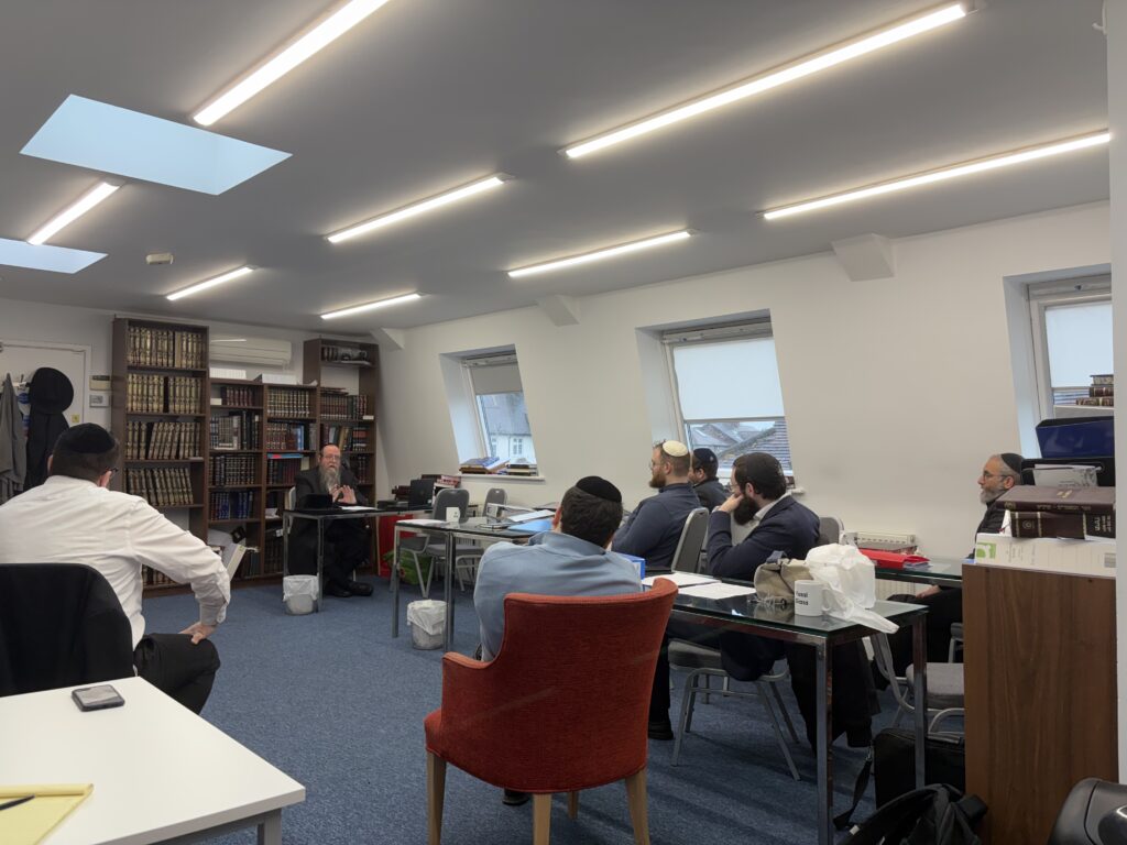 Rabbi Akiva Padwa speaking to the rabbinic training academy